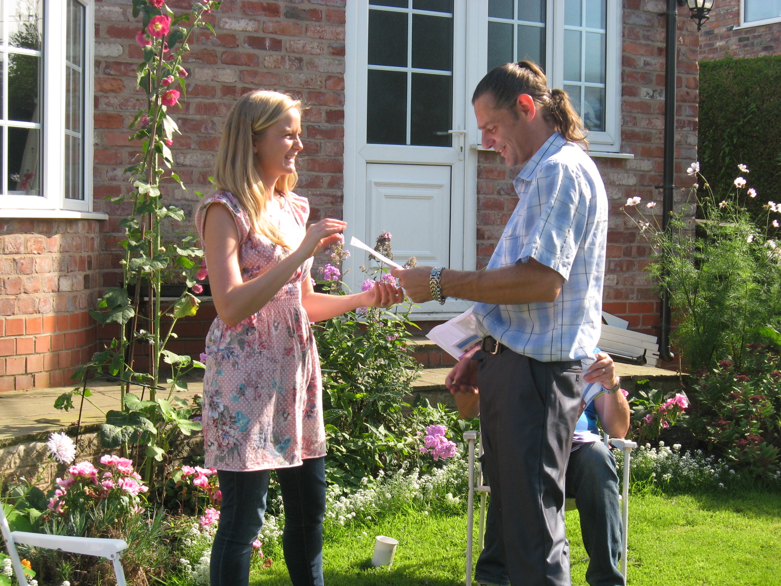 Neil receiving his certificate from Lauren