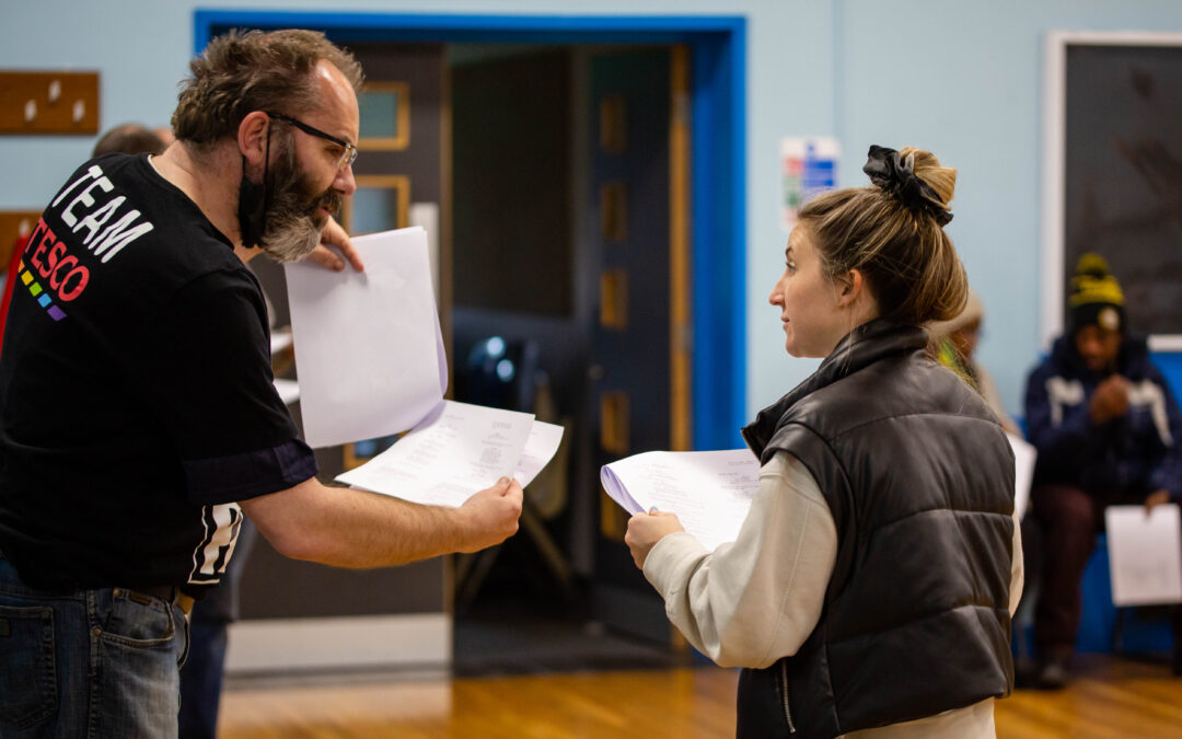 Two people discussing script