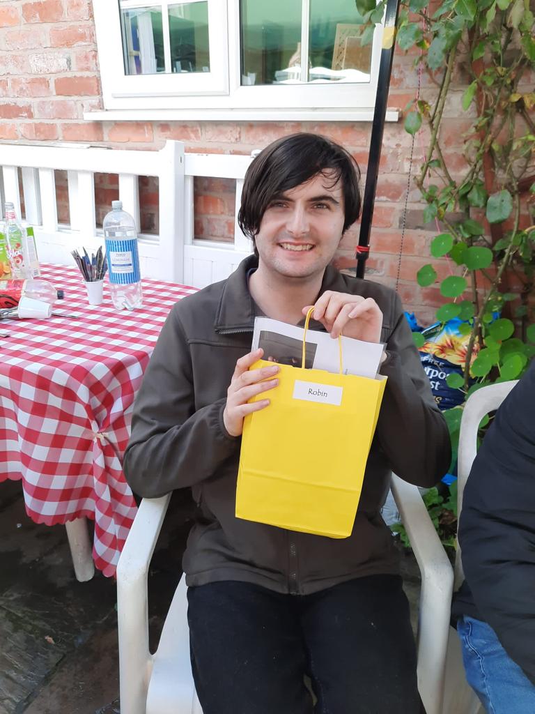 Actor smiling having been award bag of memories from making Oglebox