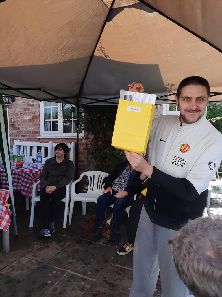 Actor smiling having been award bag of memories from making Oglebox